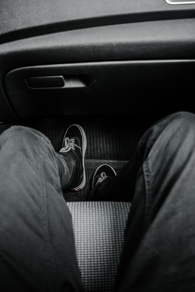 Dressed in a black pants and black and white sneakers
